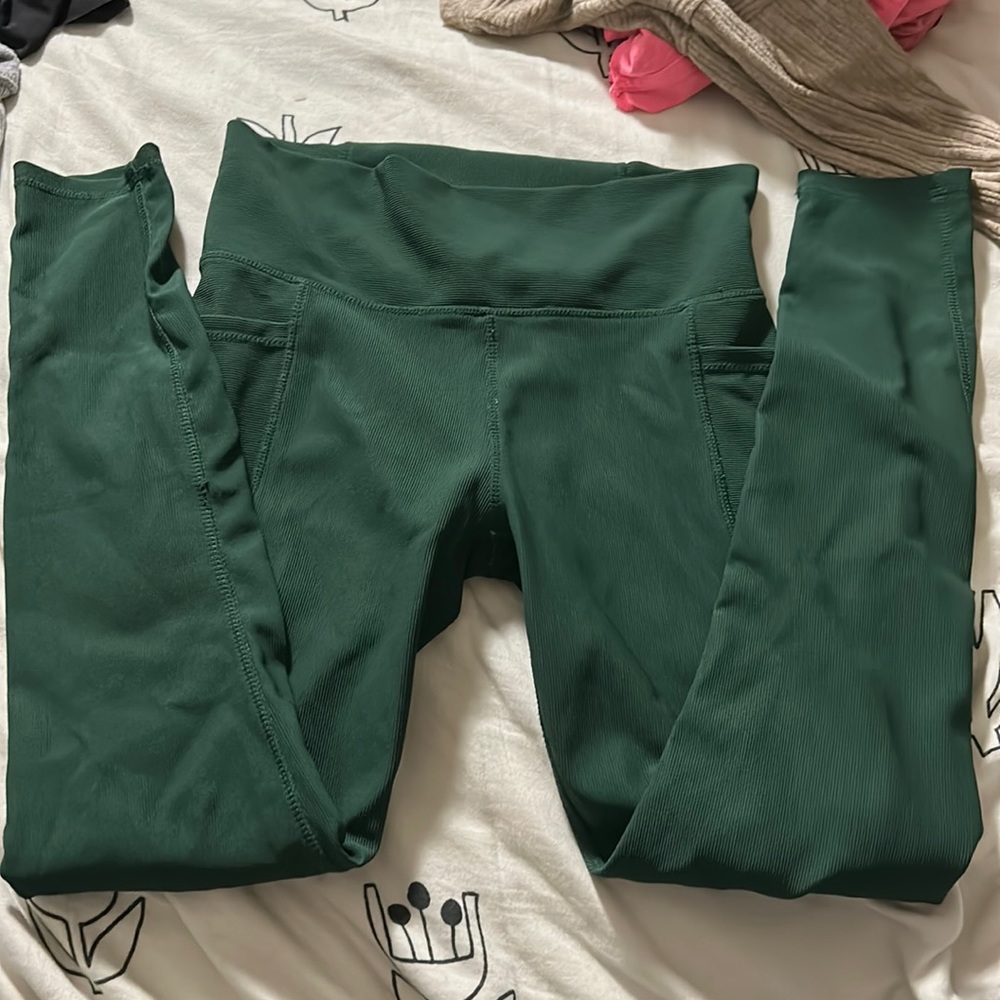 Dark green leggings.
